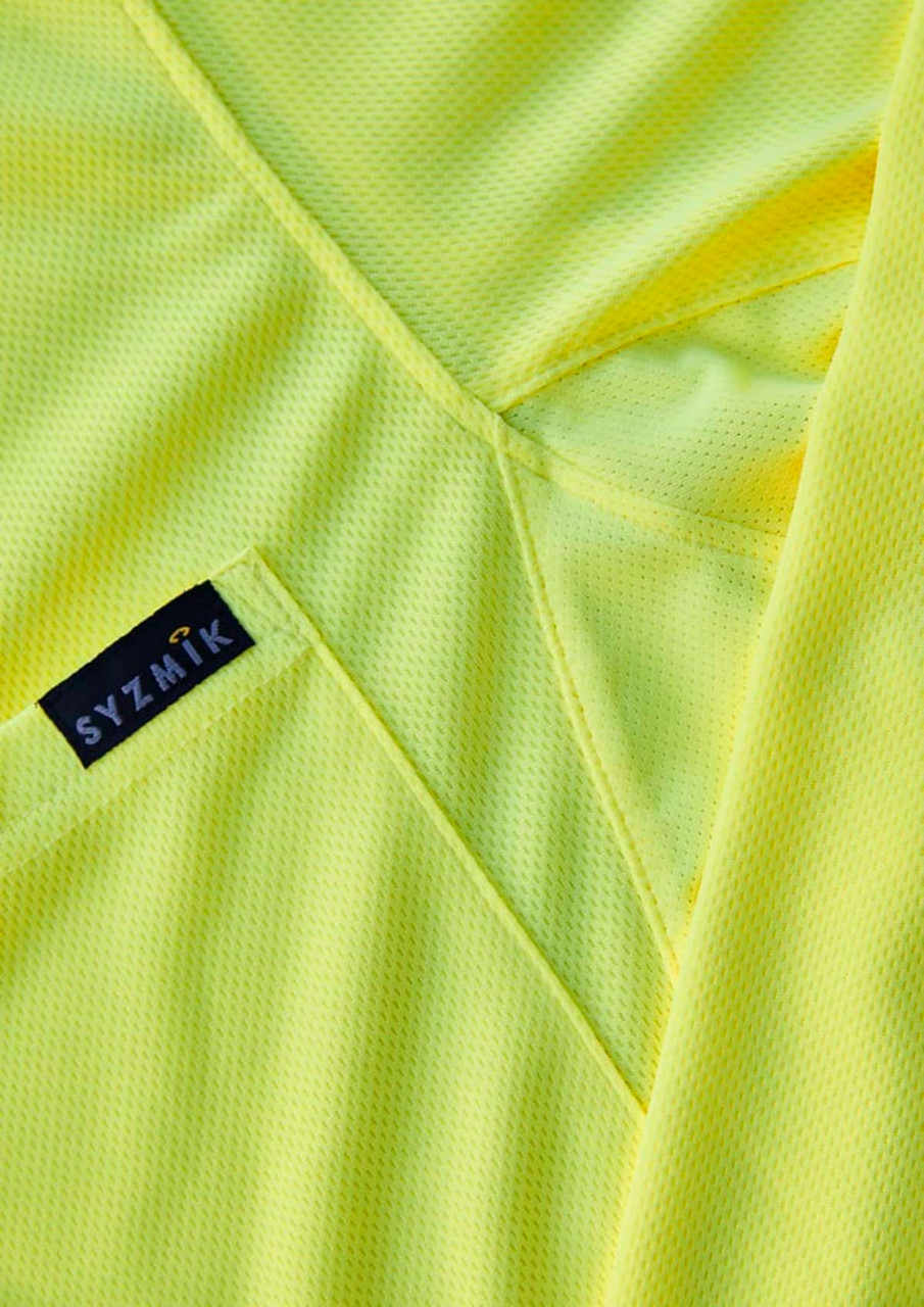 A close-up of a men's long sleeve polo in bright yellow, featuring a logo on the fabric.