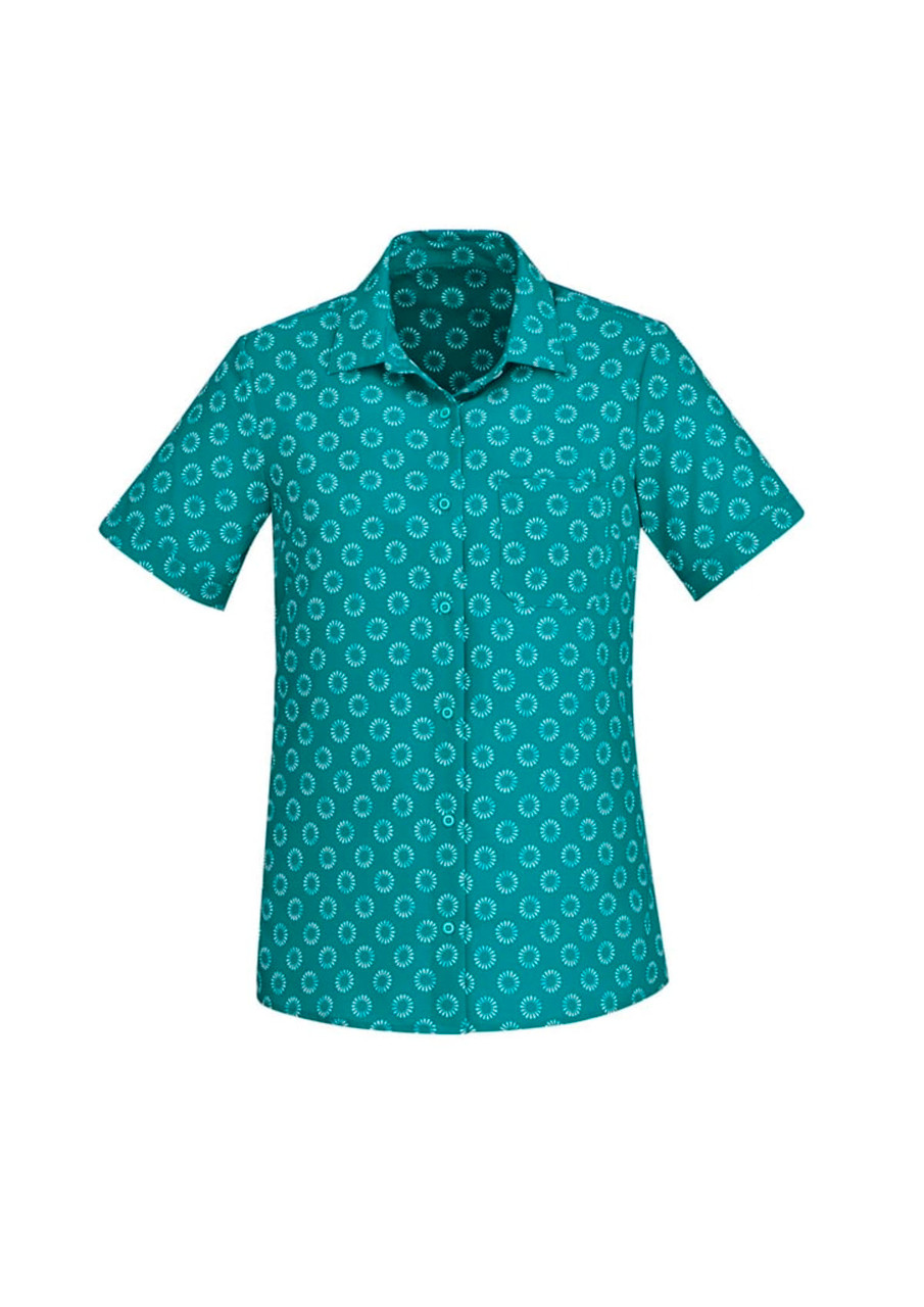 A teal short sleeve button-up shirt with a white daisy print pattern and a chest pocket. It features a logo.