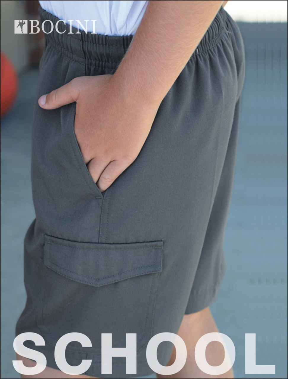 Kids school cargo shorts in dark grey, featuring a side pocket and elastic waistband. Includes a logo.