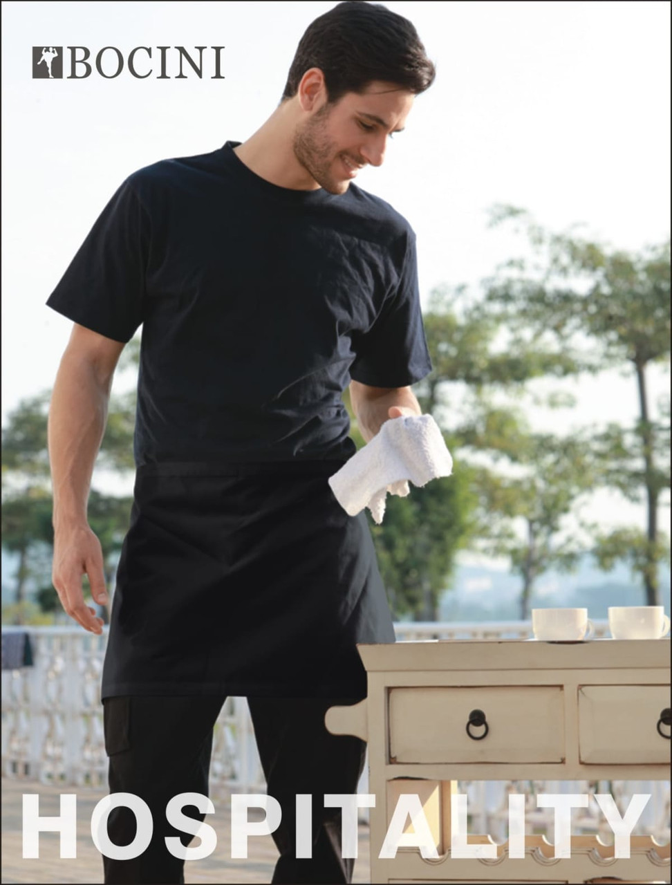 A black polyester drill quarter apron with a model holding a cloth, set outdoors. Features a logo.