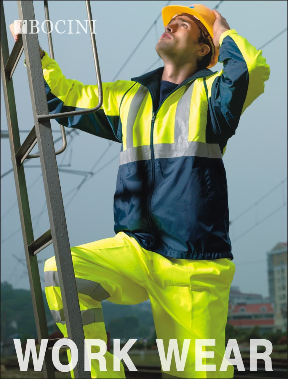 A man in a hi-vis yellow and navy jacket and pants, wearing a hard hat, stands on a ladder outdoors.
