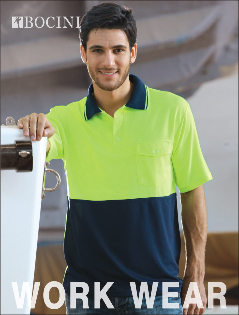 A male model wearing a short sleeve, high-visibility safety polo in bright yellow and navy blue, featuring a pocket and logo.