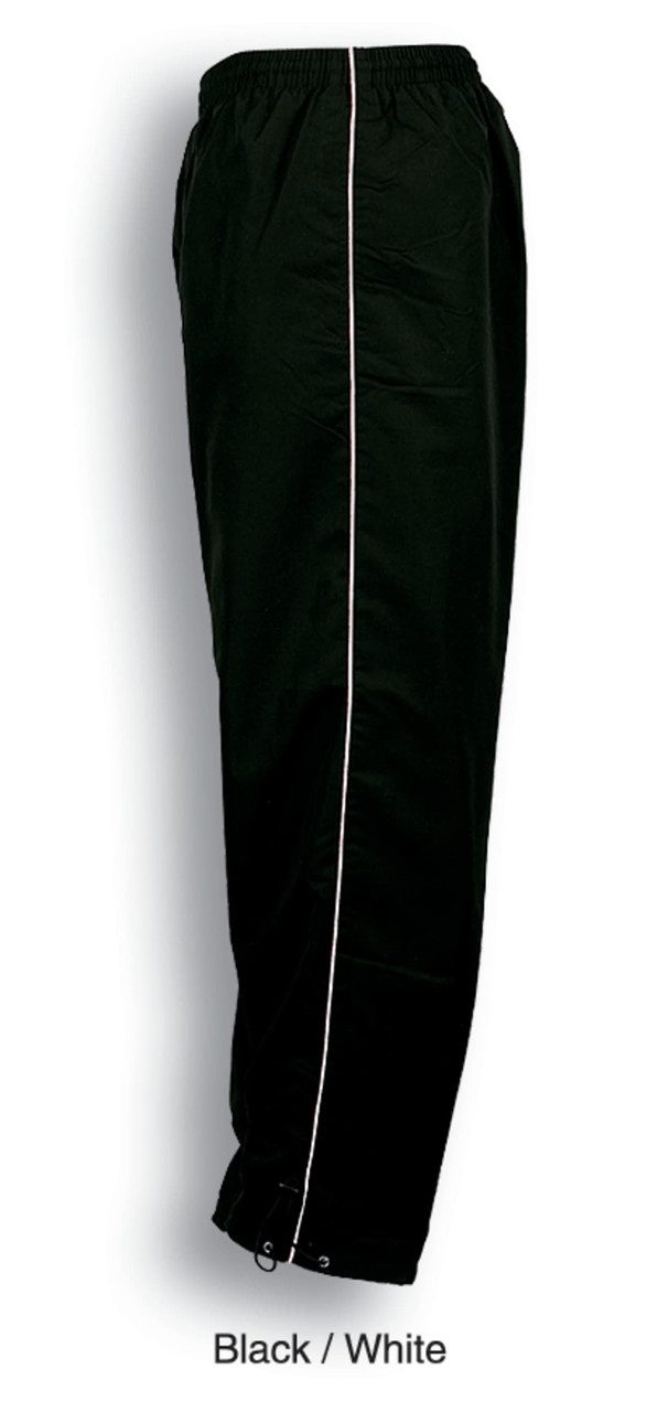 Unisex track pants in black featuring white piping down the sides, with an elastic waistband.