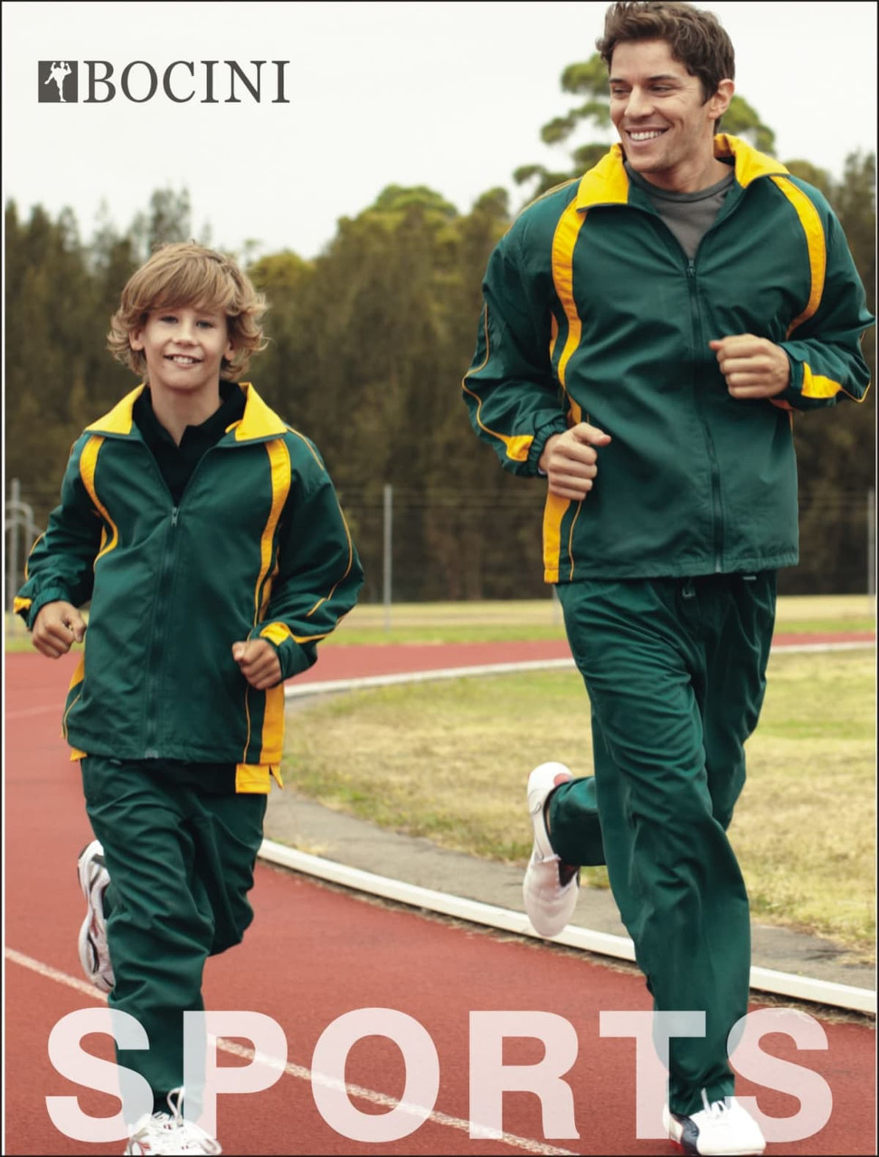 A green and yellow tracksuit is worn by an adult and a child, jogging on a track surrounded by trees.