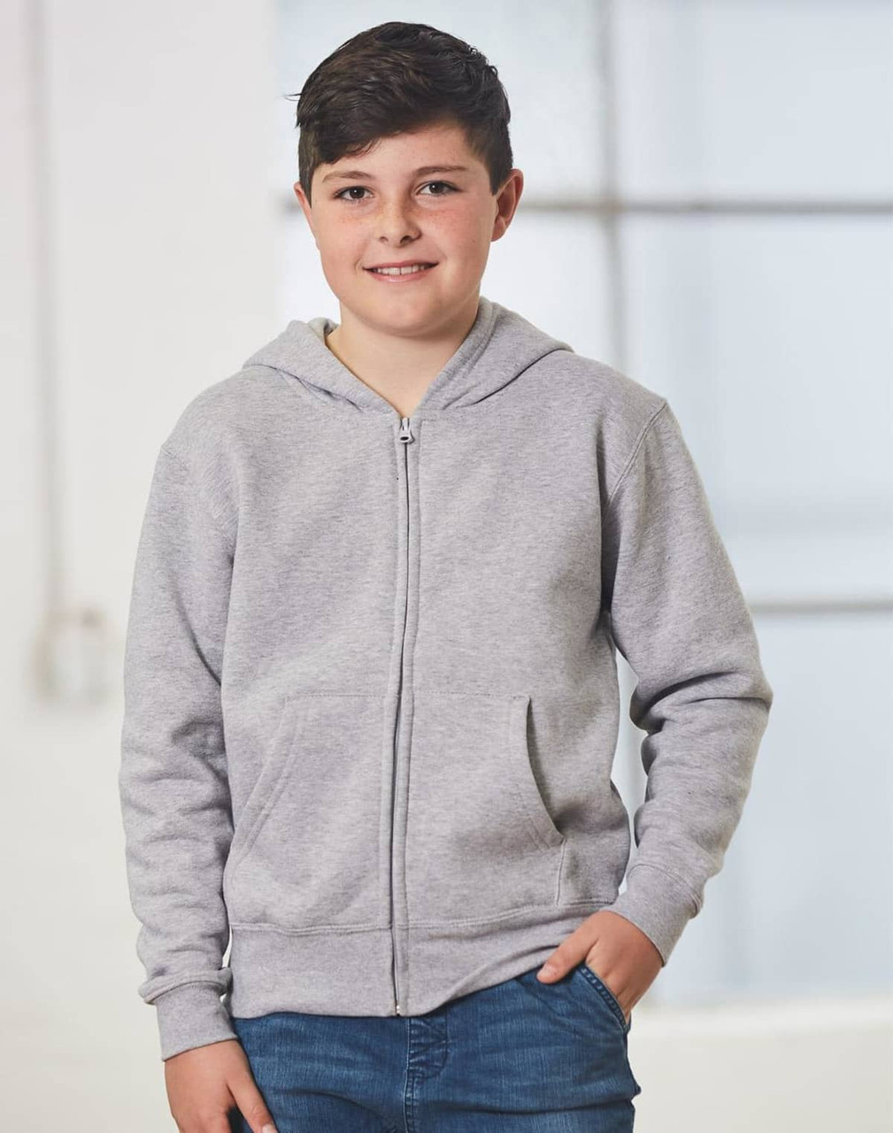 A grey full-zip fleecy hoodie featuring a hood and front pockets, modelled by a young boy.