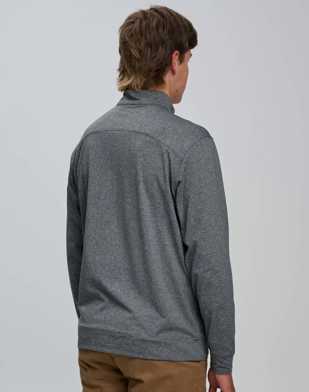 A men's half zip long sleeve sweatshirt in grey, featuring a simple design and a logo on the back.