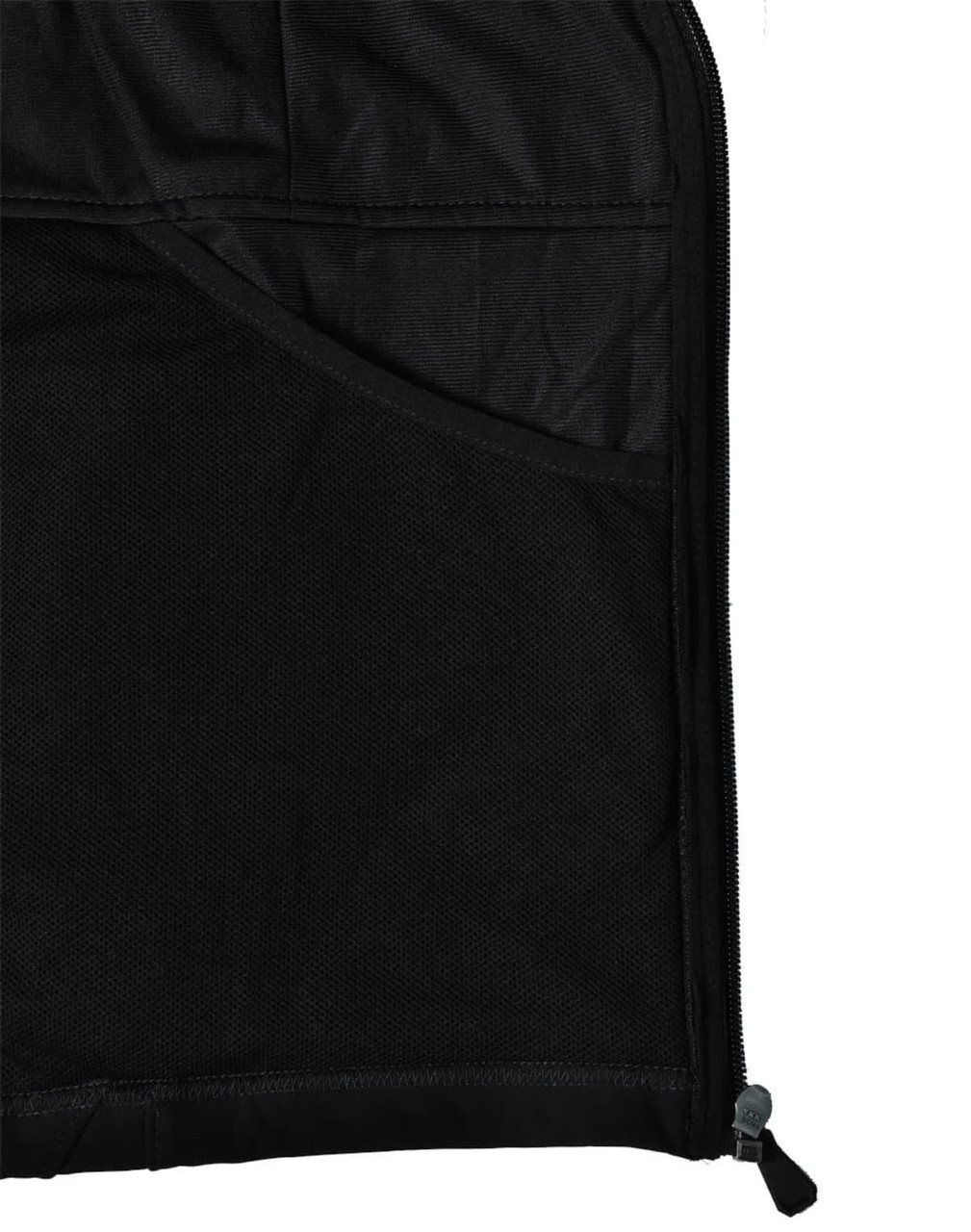 A close-up of the interior of a black softshell jacket, featuring a mesh pocket and zipper detail.