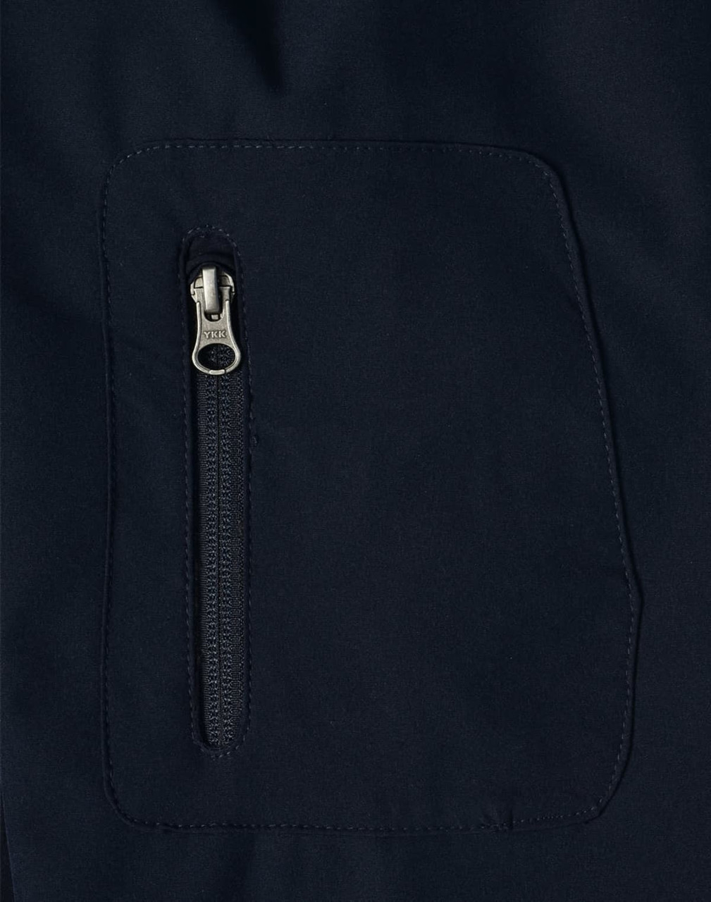 A close-up of a navy softshell jacket featuring a zippered pocket. The fabric appears smooth and durable.