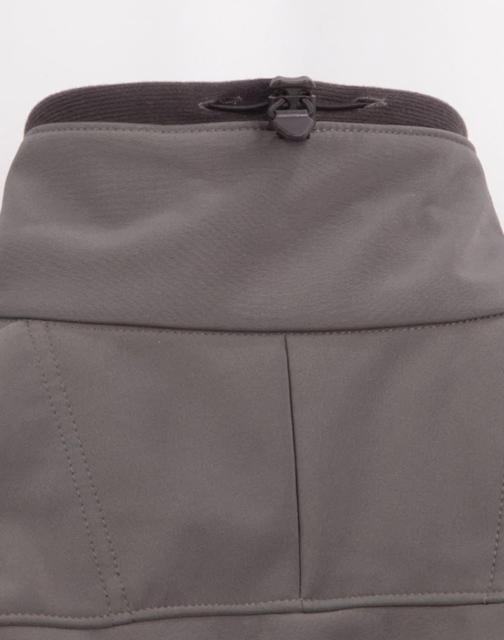 A grey ladies softshell hi-tech jacket featuring a high collar and adjustable cord at the neckline.