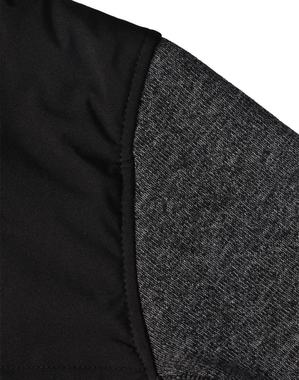 A close-up of a men's jacket featuring a quilted black body and grey heather sleeves, with a logo visible.