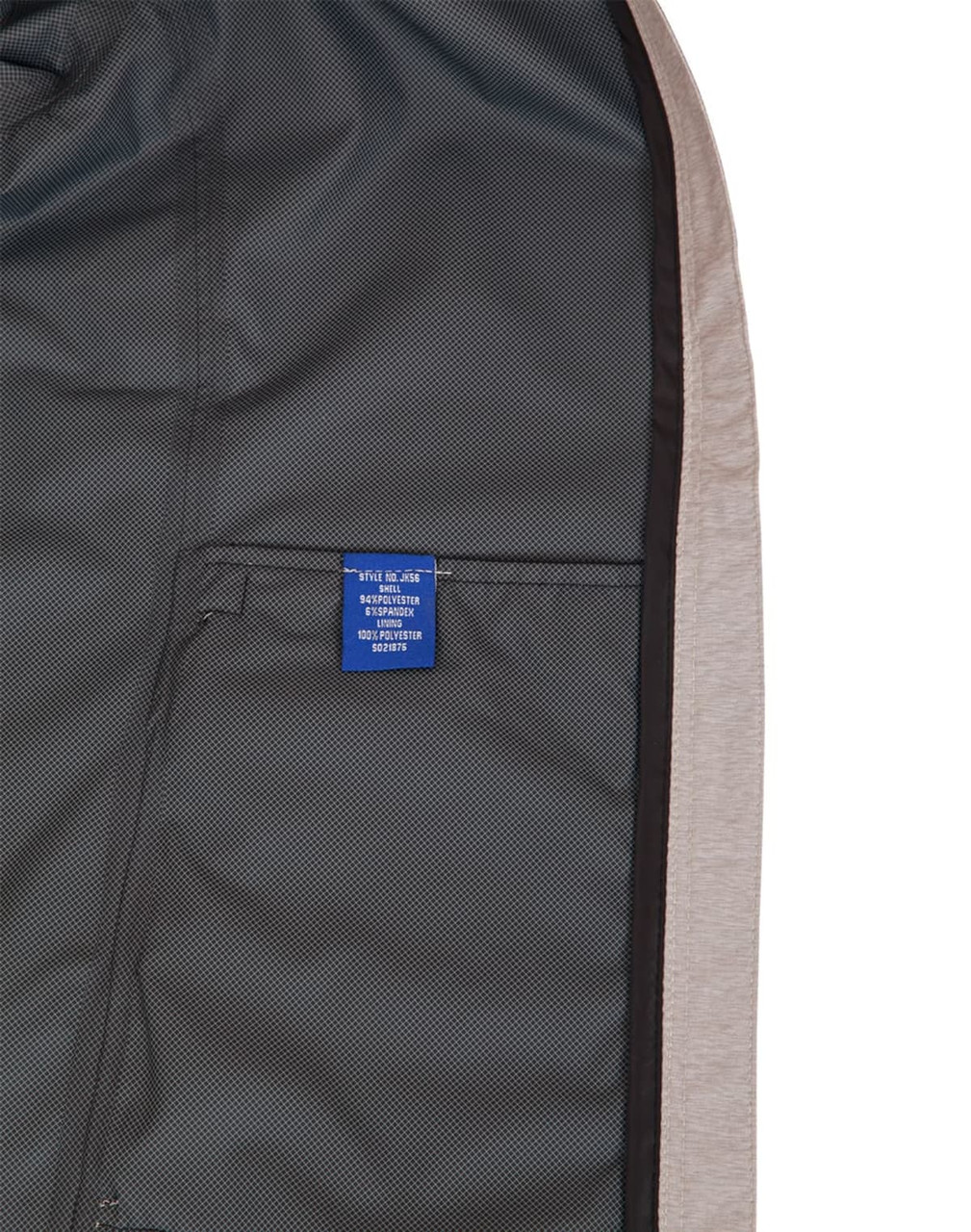 A men's waterproof performance jacket in grey with a mesh lining and a visible interior label.