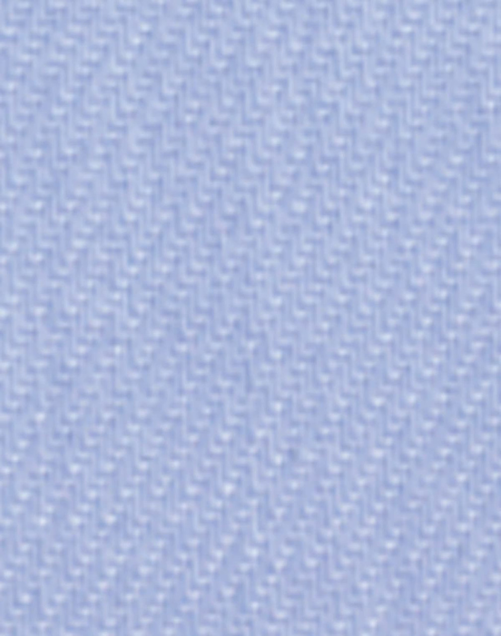 A close-up of light blue fine twill fabric, featuring a textured woven pattern, suitable for button-up shirts.