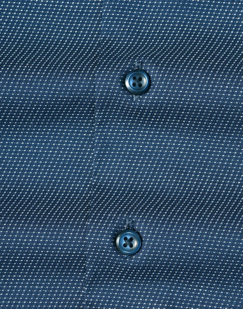 Men's long-sleeve button-up shirt in navy with a pin dot pattern and contrasting buttons. Features branding.