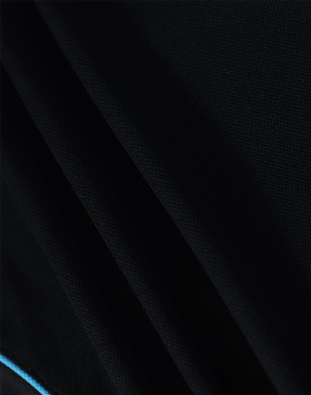 A black polo shirt featuring a blue trim and a logo. The fabric texture is clearly visible.