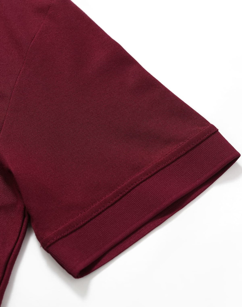 A maroon polo shirt with short sleeves, featuring a neatly finished collar and a logo.