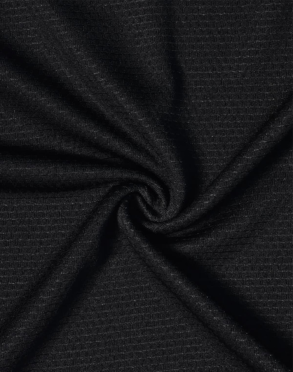 A close-up of black bamboo charcoal fabric with a textured weave, showcasing its soft and breathable quality.