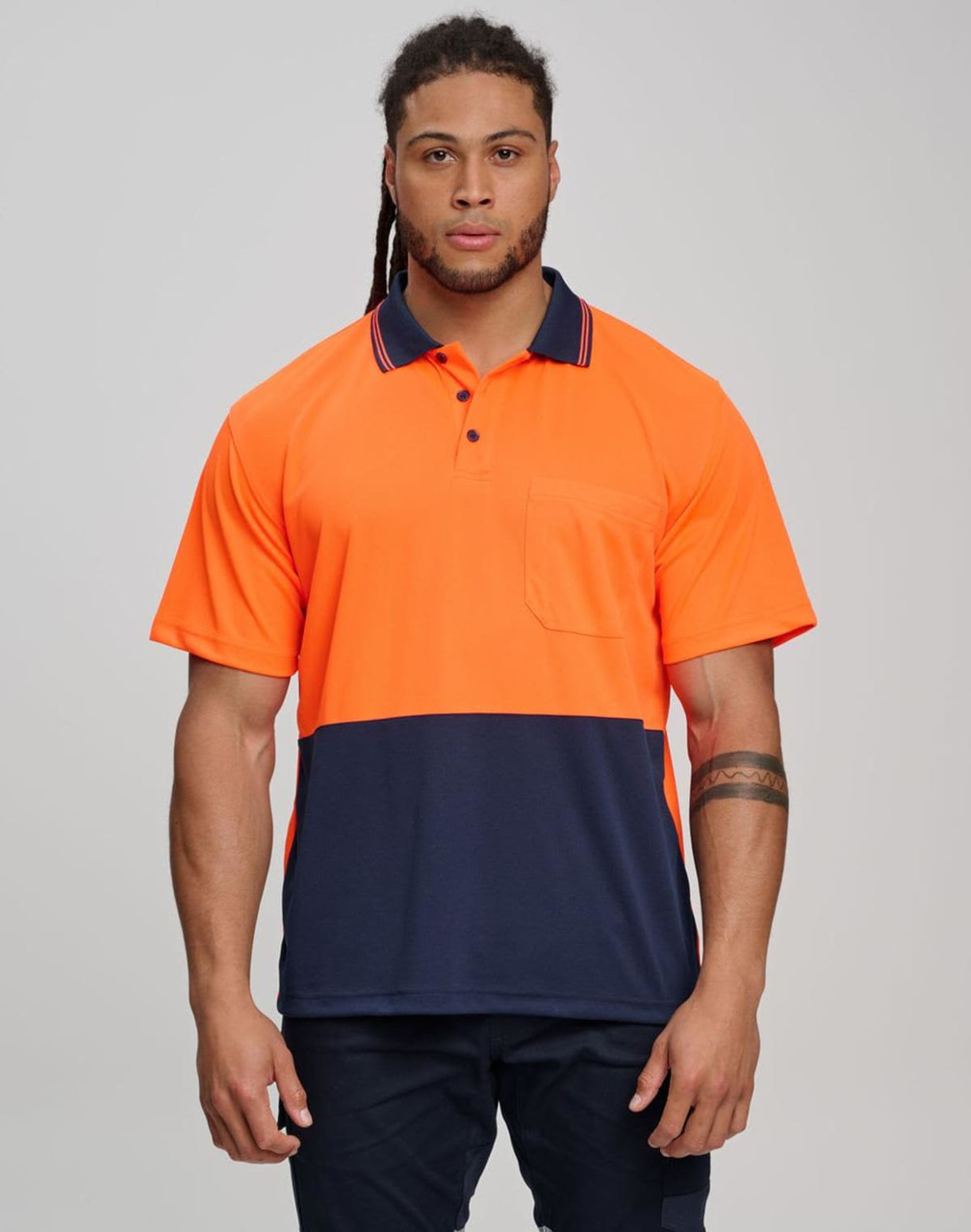 A high-visibility short-sleeve safety polo in bright yellow with a navy blue bottom section and a pocket.