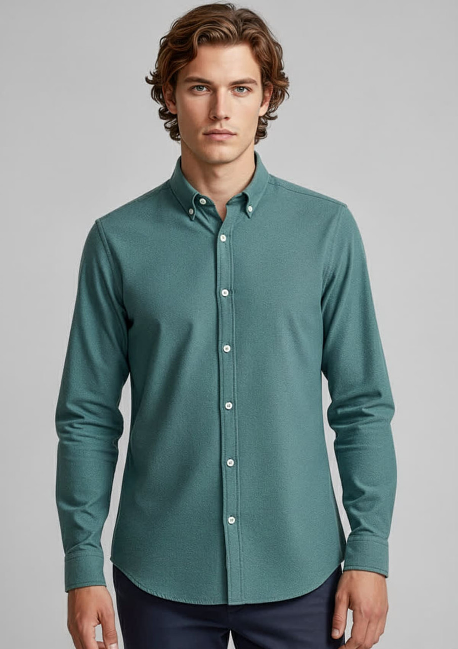 A long sleeve button-up shirt in a teal colour with a button-down collar and a logo on the chest.