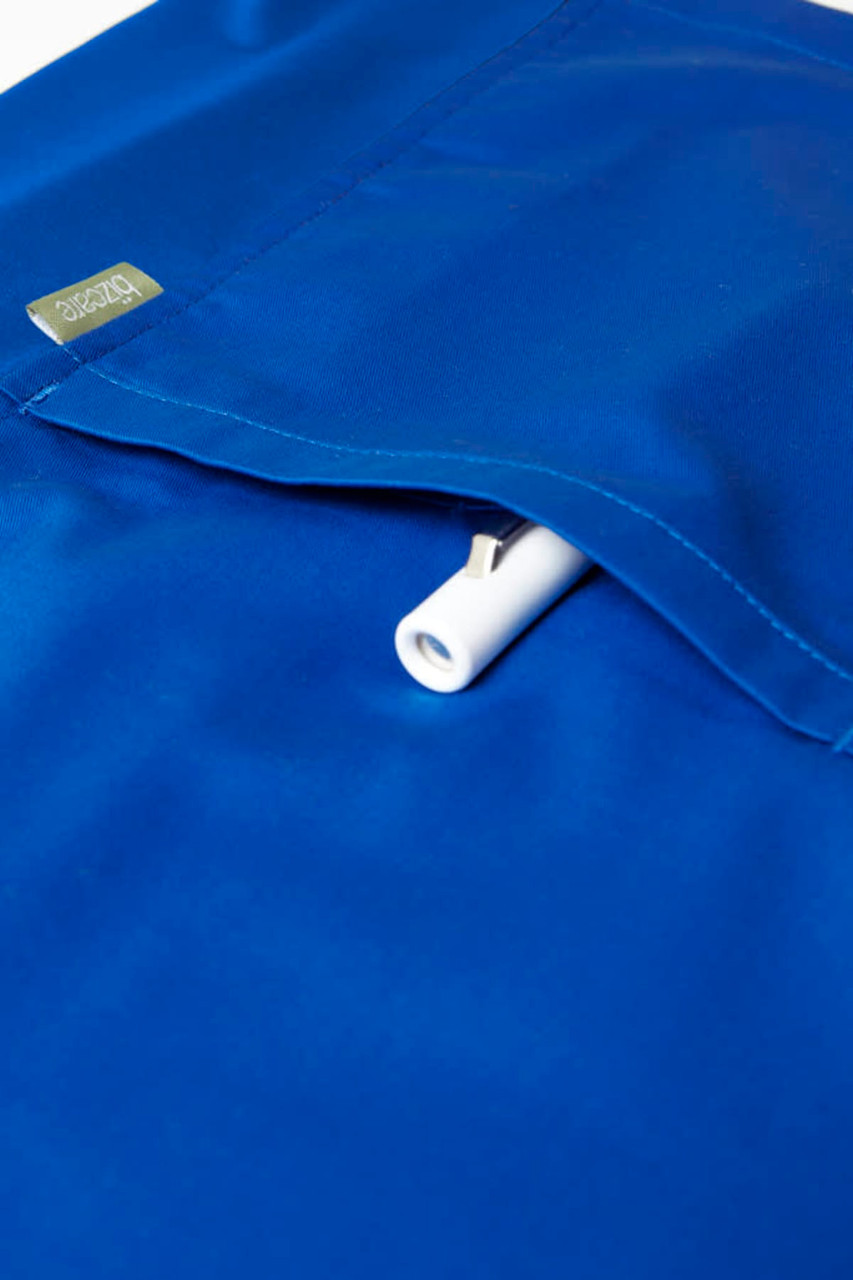 A blue men's scrub top featuring a pocket and a logo. The material appears smooth and professional.
