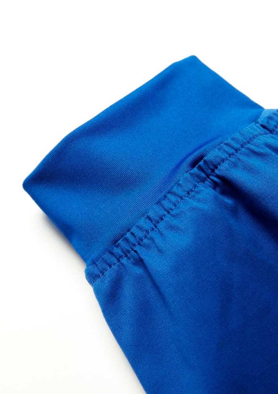 A pair of blue jogger scrub pants featuring a fitted waistband and elastic details.