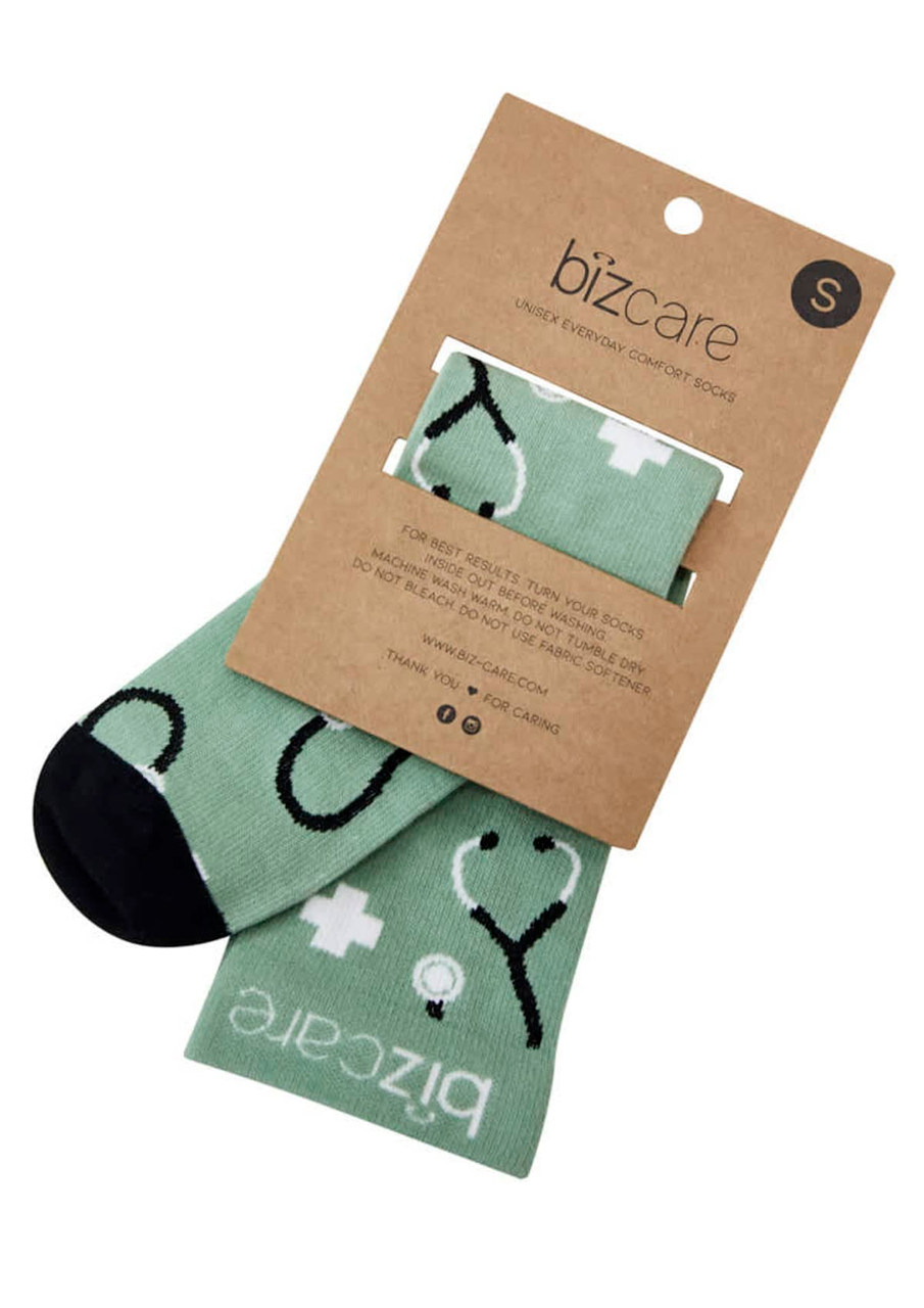 Unisex Happy Feet Comfort Socks in mint green with black accents and a design featuring hearts and plus signs.