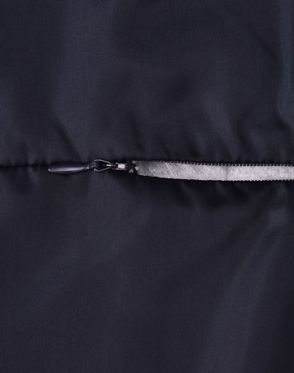 A close-up of a dark puffer jacket featuring a zip closure and a smooth fabric texture. The jacket has a logo.