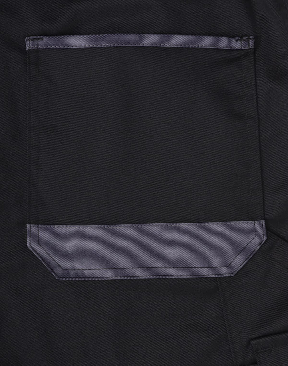 A close-up of a black cargo short featuring a grey pocket on the side, designed for utility and practicality.