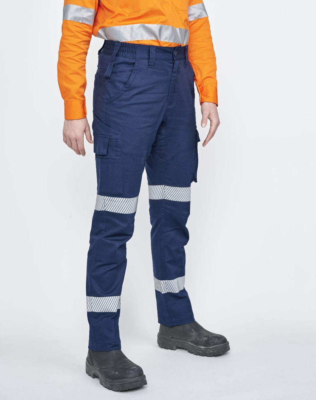 Unisex cotton stretch ripstop segmented work pants in navy with reflective strips, paired with an orange long-sleeve shirt.