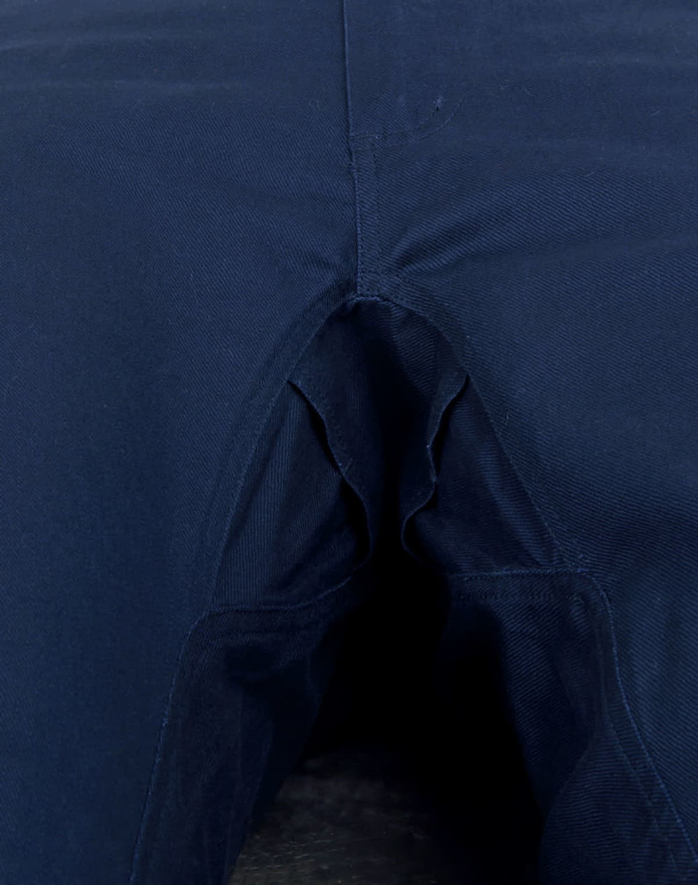 Unisex cotton stretch ripstop work pants in navy blue with a detailed view of the crotch area. Features a logo.