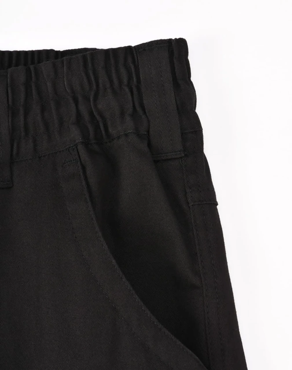 A pair of black unisex cotton stretch drill work pants featuring a cuffed design and an elasticated waistband.