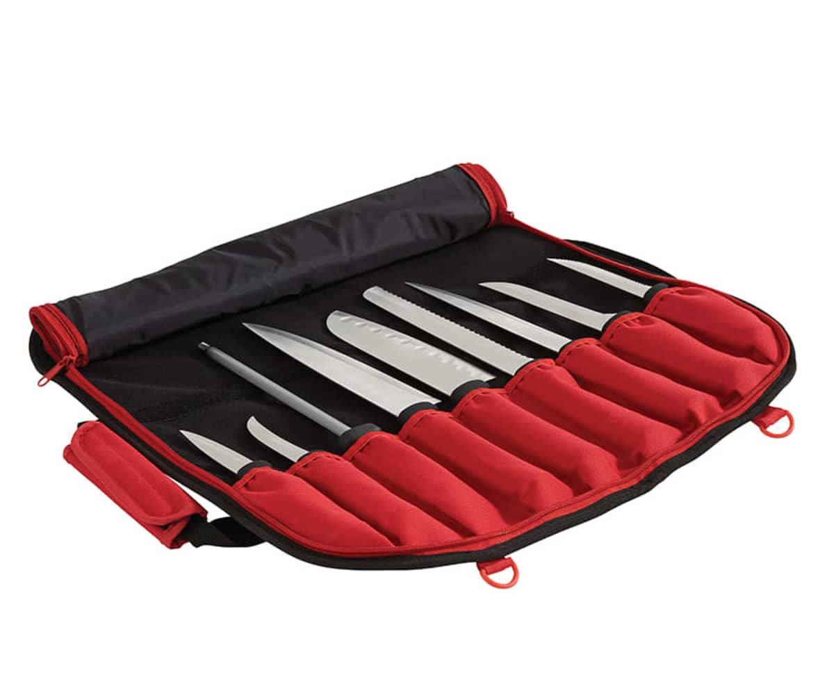 A black and red knife bag contains several steel knives securely stored in individual slots. The bag has a closed design.