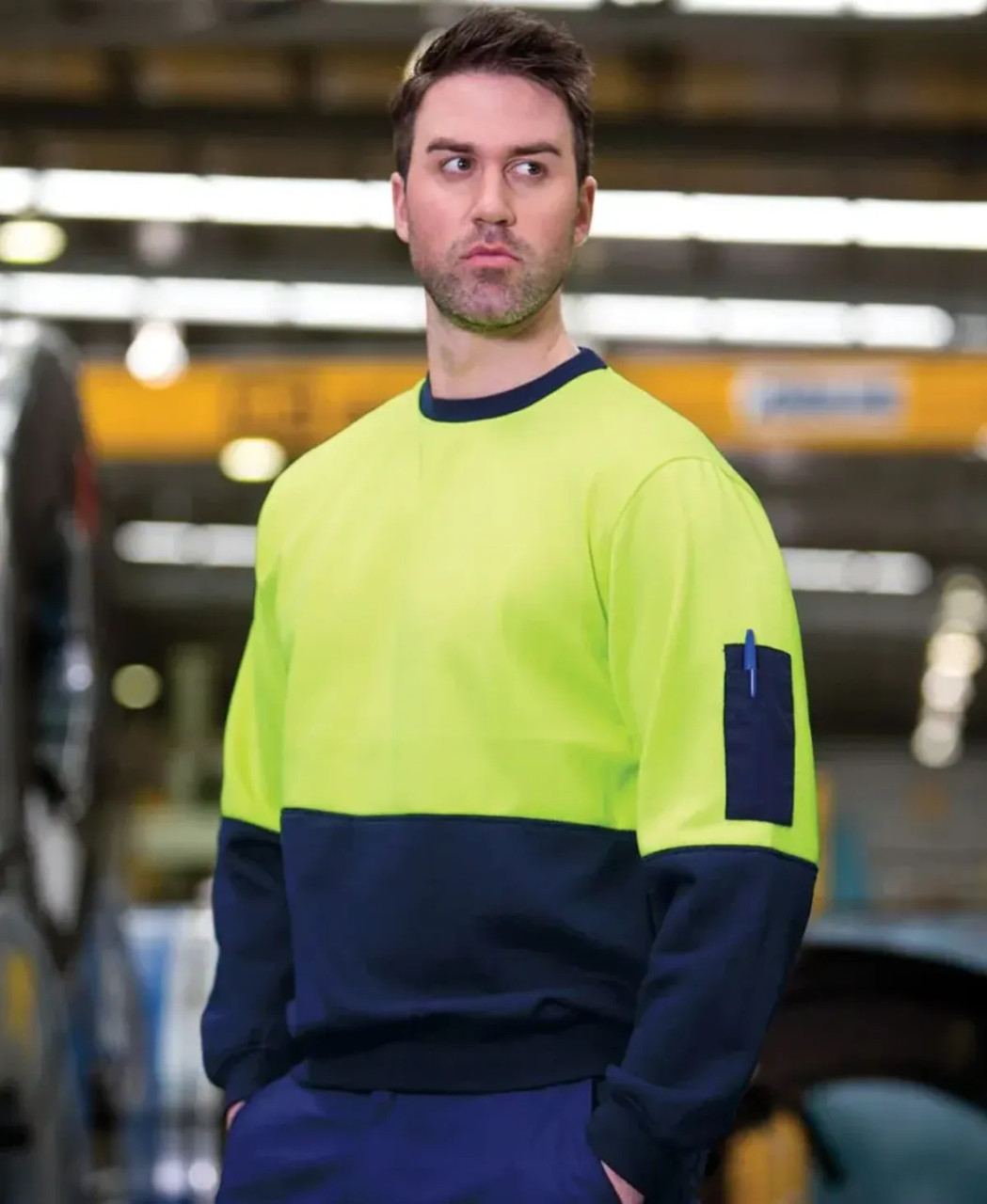 A bright yellow and navy work jumper featuring a logo, designed for workwear usage.