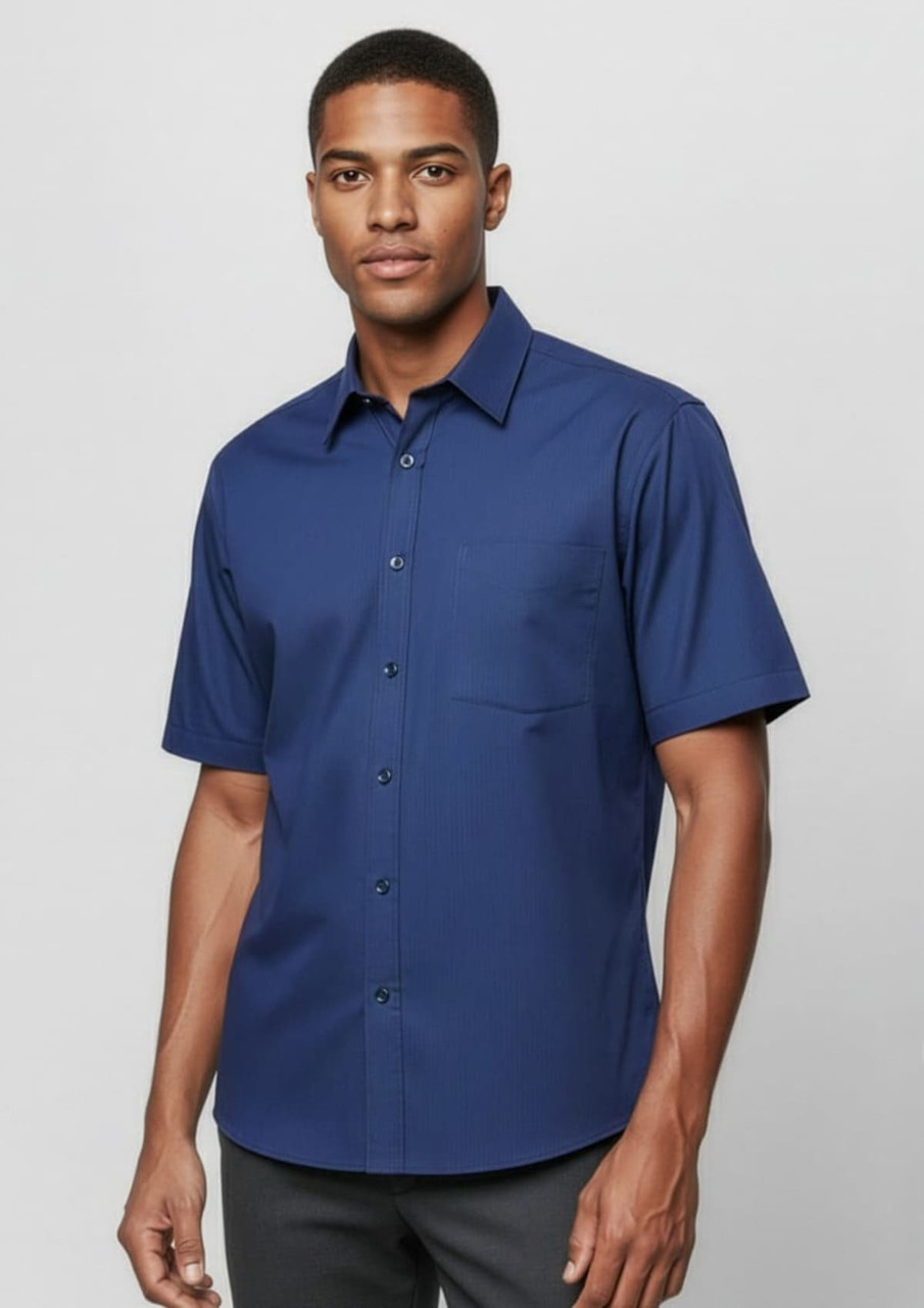 A navy short sleeve button-up shirt with a collar and single chest pocket, featuring a subtle micro check pattern.