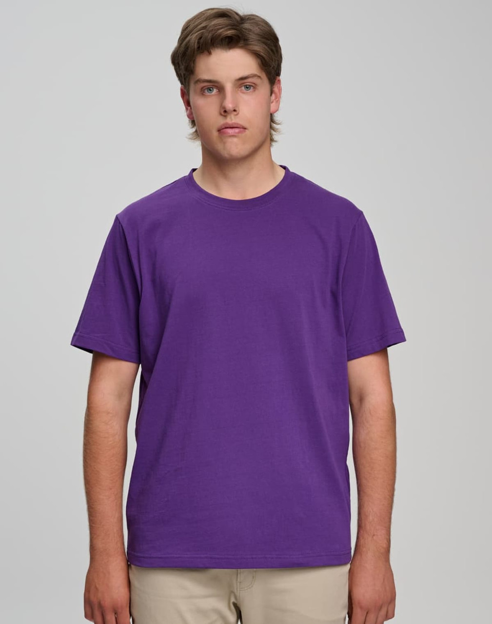 A purple semi-fitted men's cotton T-shirt displayed on a model against a neutral background.