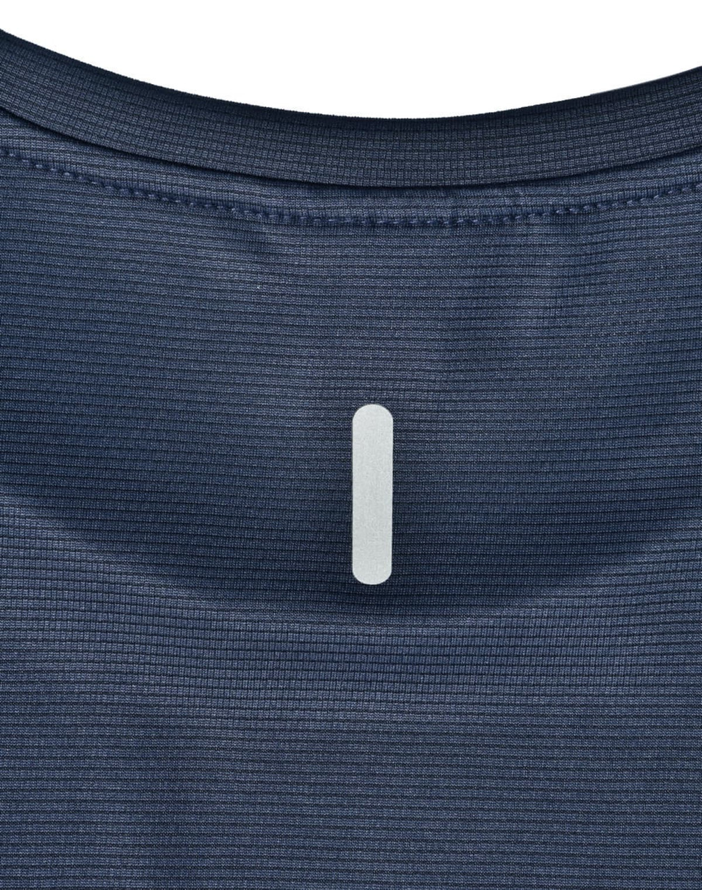 A close-up of a navy blue ladies' ultra lightweight performance t-shirt, featuring a subtle logo at the neckline.