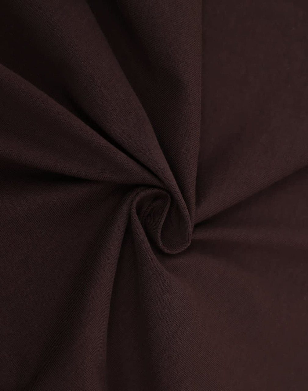 A close-up of brown fabric, showcasing a smooth, premium cotton texture suitable for making t-shirts.