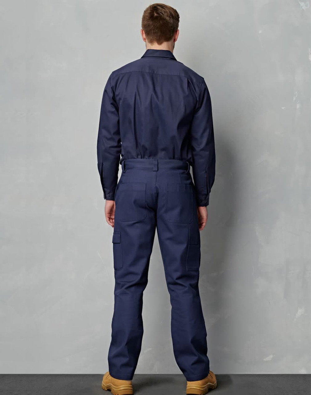 Navy blue men's cotton drill cargo pants with knee pads, featuring a fitted design and pockets.
