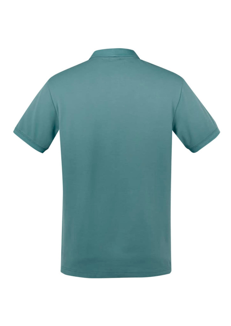 A polo shirt in a soft green hue, featuring a classic collar and short sleeves, with a logo on the front.