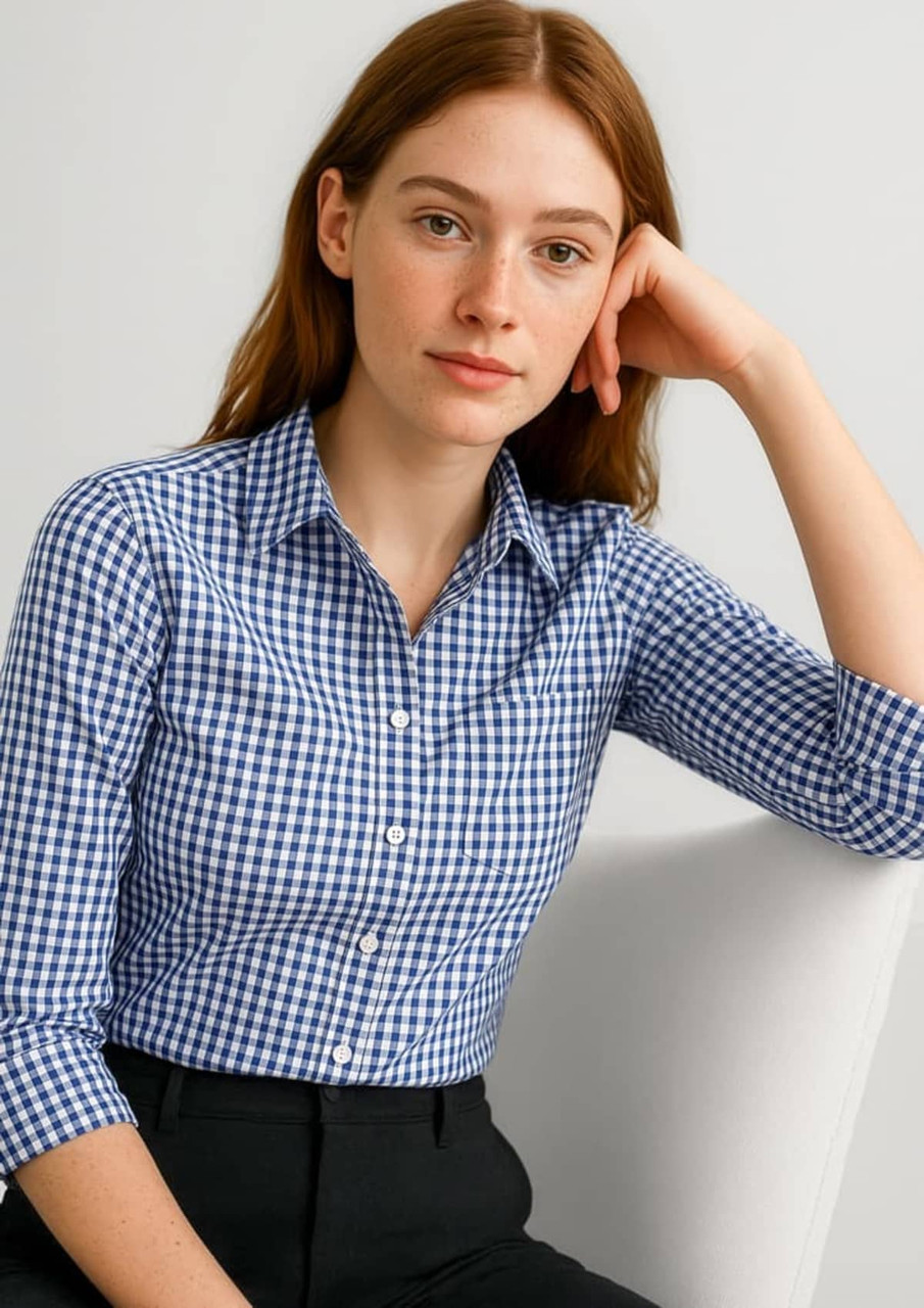 A women's button-up shirt featuring a blue and white gingham pattern with 3/4 sleeves and a logo.