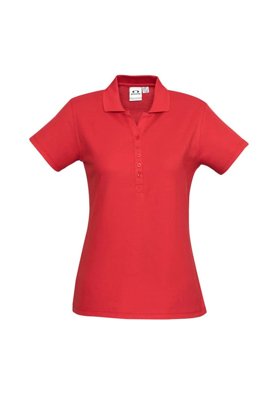 A red polo shirt featuring a collar, short sleeves, and a button placket. It has a logo on the inner tag.