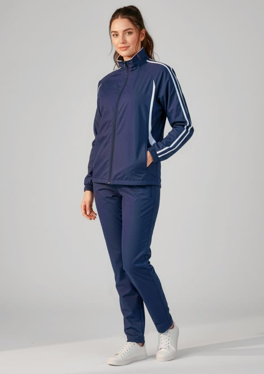 A unisex navy flash jacket with white stripes, paired with matching trousers, featuring a logo.