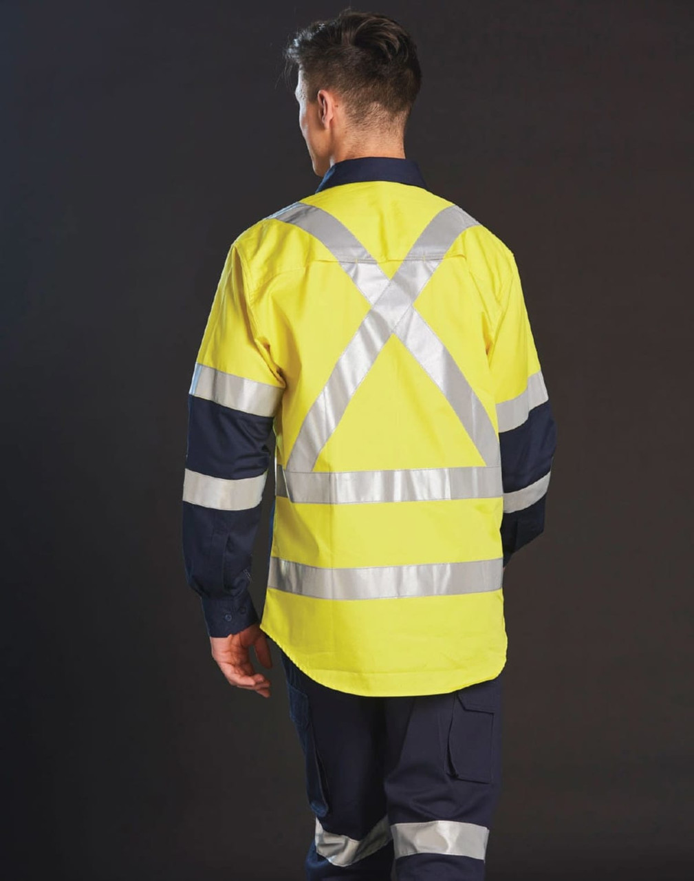 A two-tone work shirt featuring reflective tape, primarily in yellow with navy blue sleeves.