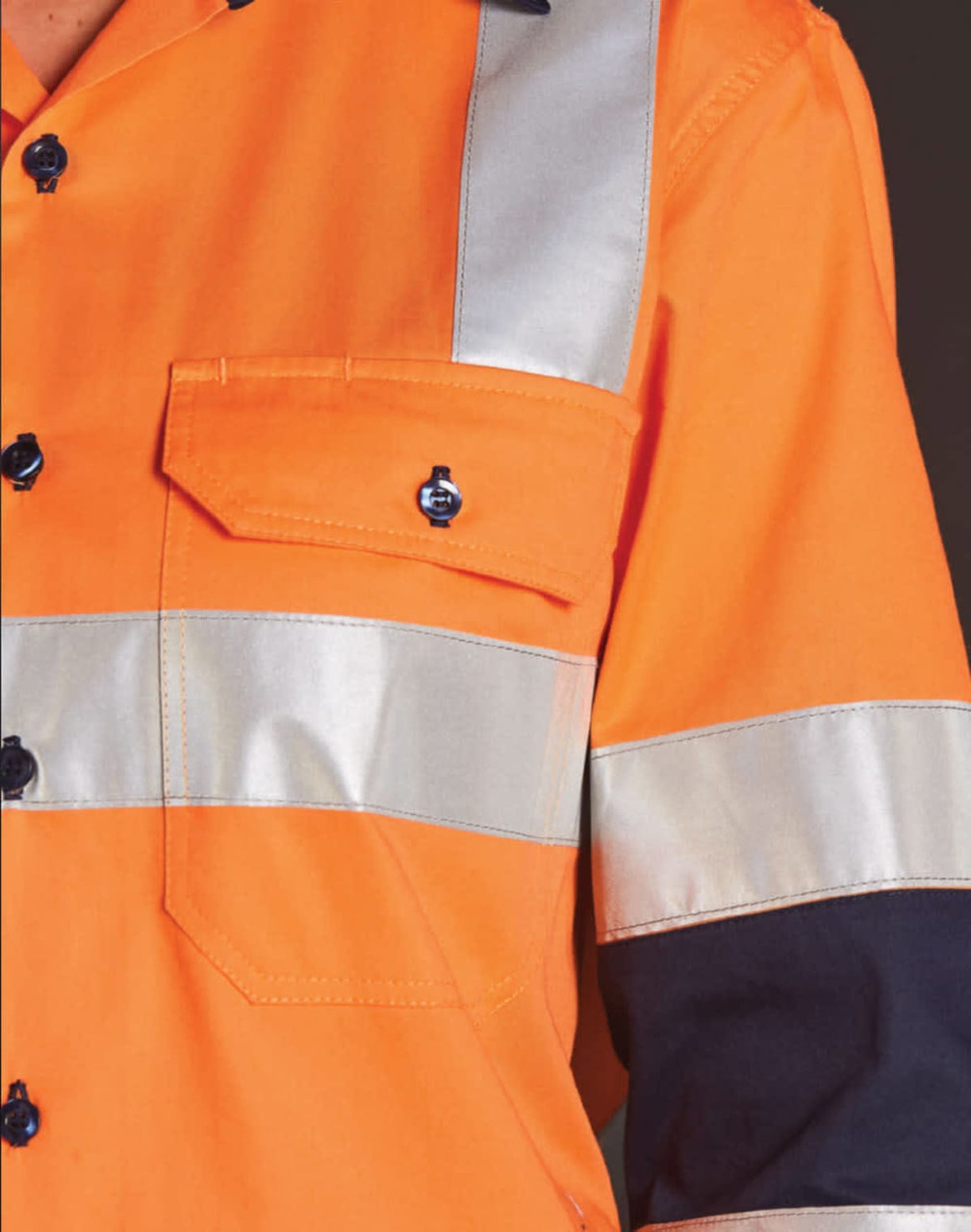 An orange work shirt with reflective silver stripes, featuring a pocket and black sleeves. It includes a logo.