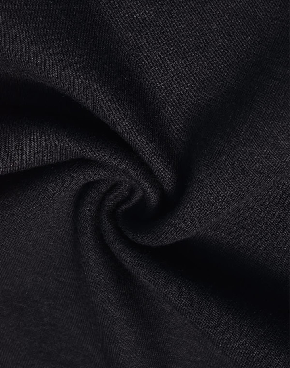 A close-up of black poly/cotton terry fabric, displaying a soft, textured surface.