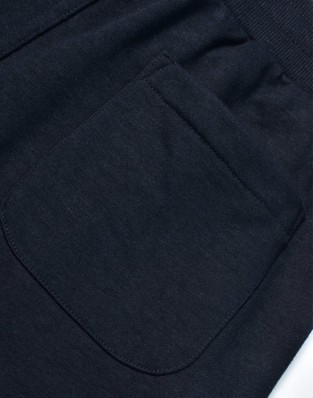 A dark grey pair of poly/cotton terry sweat pants featuring a back pocket. The fabric is soft and textured.