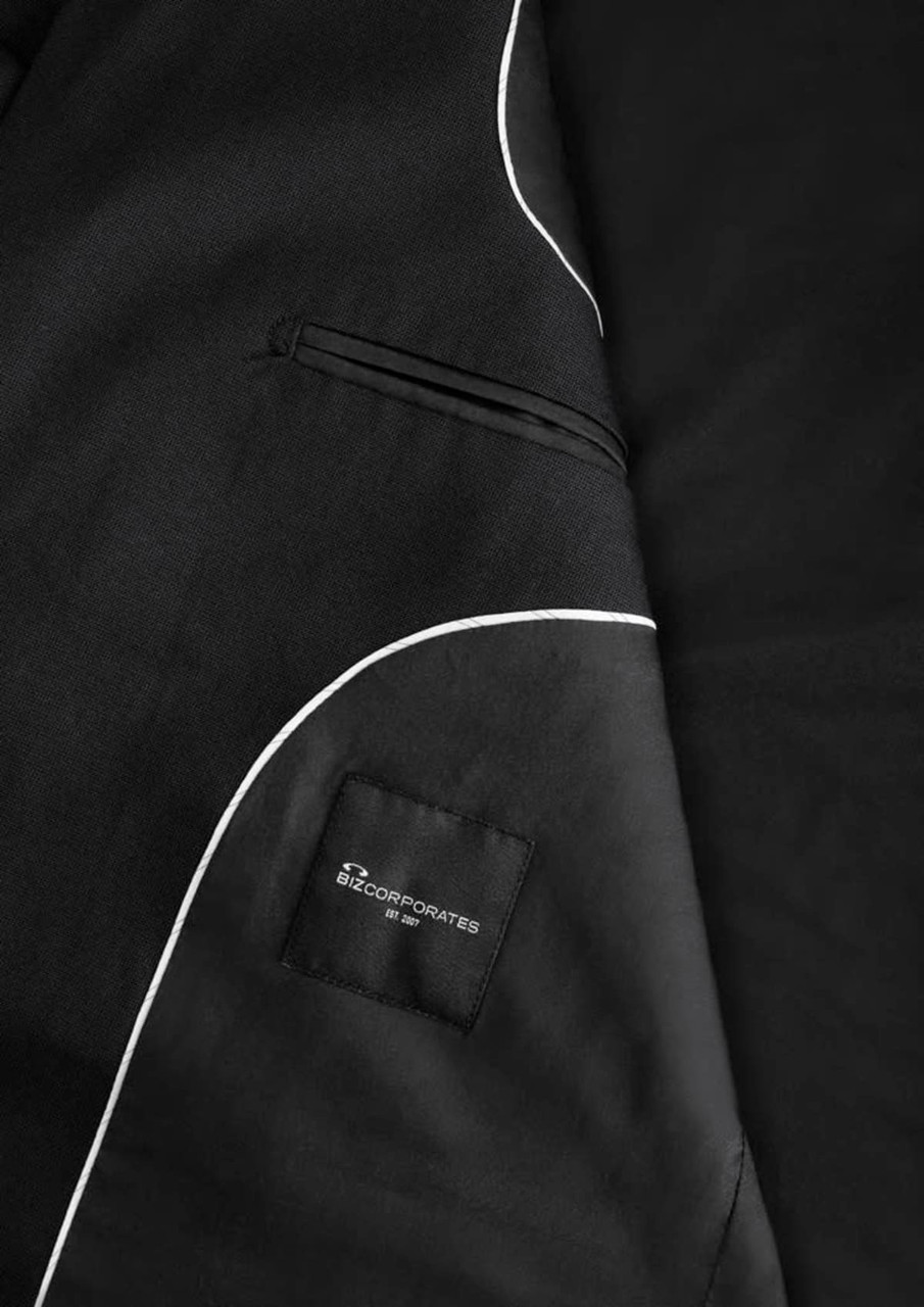 A black men's jacket featuring white piping details and a pocket with a logo.