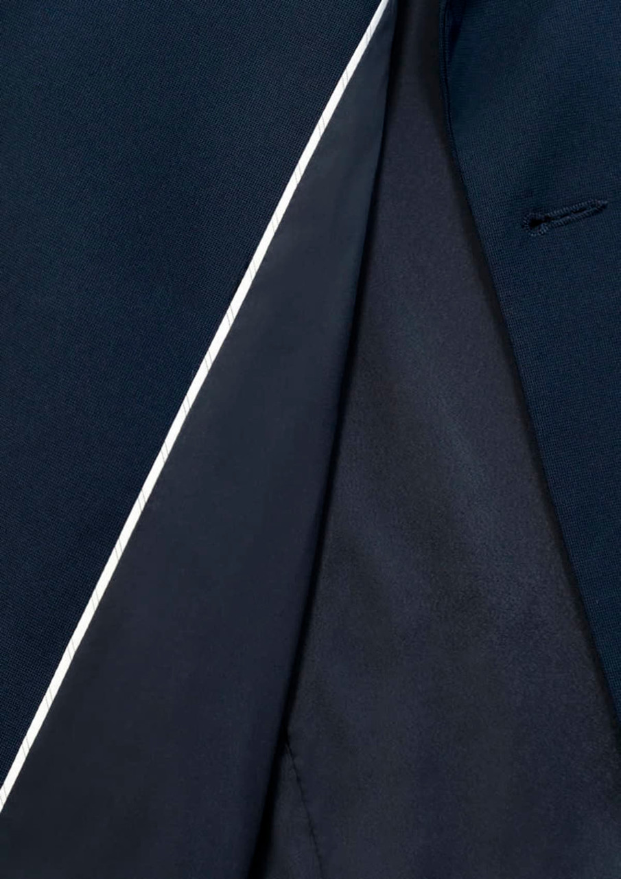 A navy blue jacket featuring a contrasting interior and a subtle white trim. It has a tailored fit.