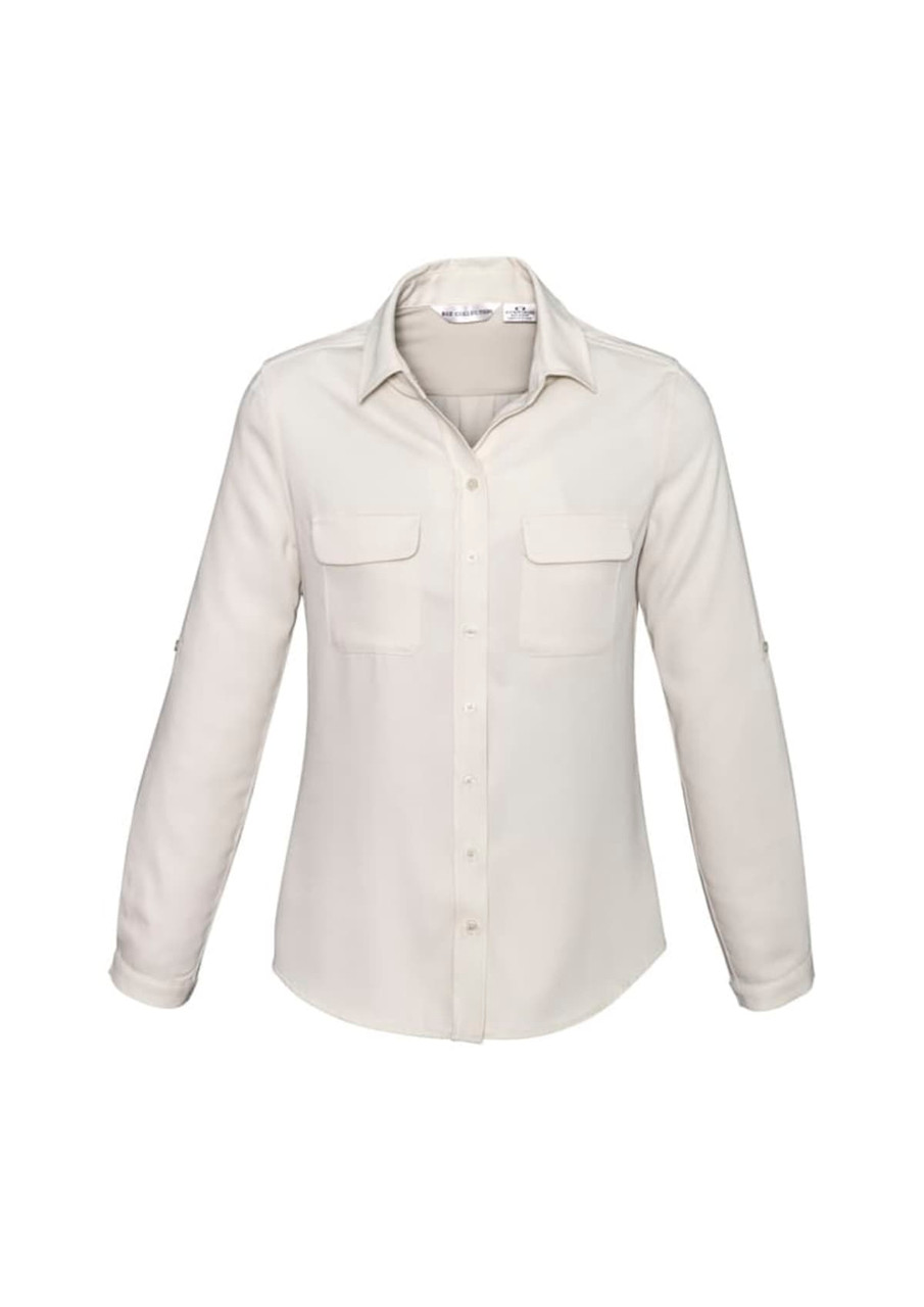 A women's button-up shirt in cream, featuring a collar and two front pockets. The shirt has long sleeves.