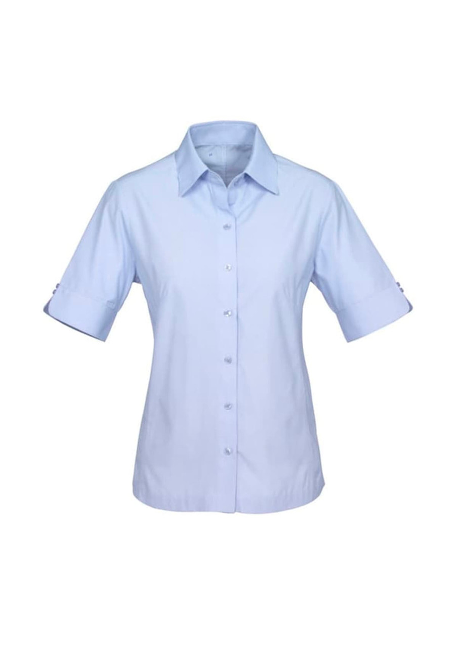 A light blue short sleeve button-up shirt for women with rolled sleeves and a subtle logo.