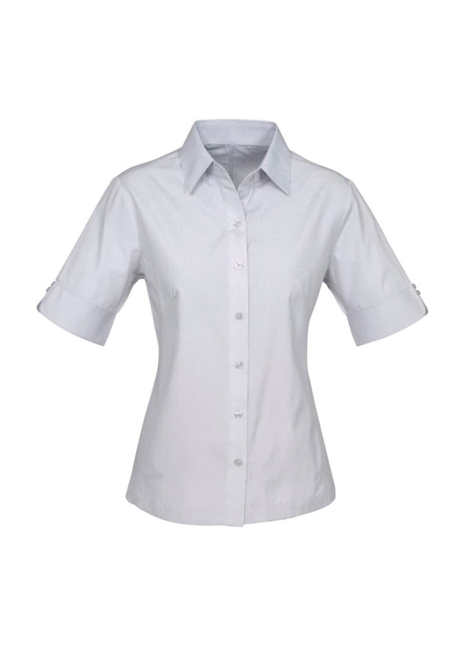 A light grey short-sleeve button-up shirt with a collar and rolled sleeves. It features a logo on the chest.